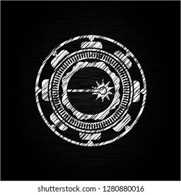 laser icon inside chalk emblem written on a blackboard