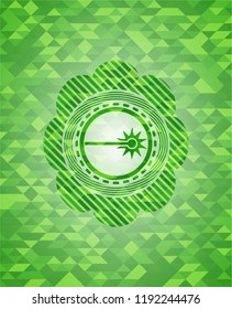 laser icon inside green emblem with mosaic background