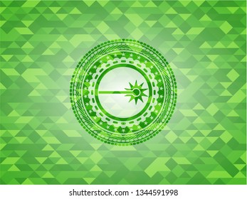 laser icon inside green emblem with triangle mosaic background