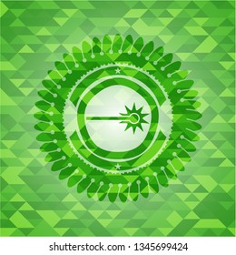 laser icon inside green emblem. Mosaic background