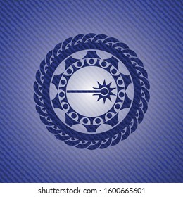 laser icon inside jean or denim emblem or badge background