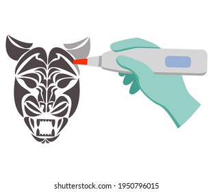 Laser tattoo removal tiger face.Removal procedure unwanted tattoos.Laser surgery.Hand holds tattoo removal machine tattoo.