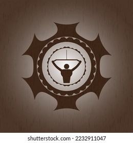 lat pull down, exercise icon inside wood emblem. 