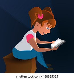 Late at night in the dark, little girl playing in the tablet computer. Child looking cartoon.