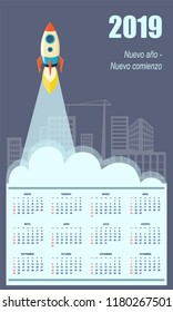 Latin-American business calendar for wall 2019 year on the blue construction background with the starting rocket. Business start up concept. Spanish language. Week starts on Sunday. eps 10
