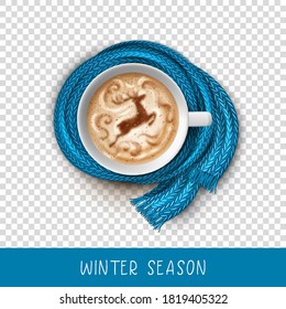 Latte coffee art. Christmas deer painted on coffee crema. Top view of a Cup of coffee wrapped in a blue scarf