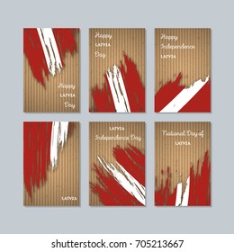 Latvia Patriotic Cards for National Day. Expressive Brush Stroke in Flag Colors on kraft paper background. Vector Greeting Card.