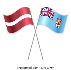 Latvian and Fijian crossed flags. Latvia combined with Fiji isolated on white. Language learning, international business or travel concept.