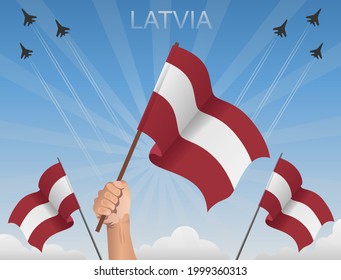 Latvian flags fluttering under the blue sky