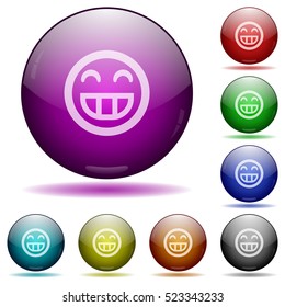 Laughing emoticon color glass sphere buttons with shadows.