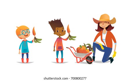 Laughing multiracial children holding carrots and female agricultural worker dressed in rubber boots and straw hat standing on one knee beside wheelbarrow full of pumpkins. Vector illustration.