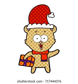riéndose oso de peluche con regalo de navidad