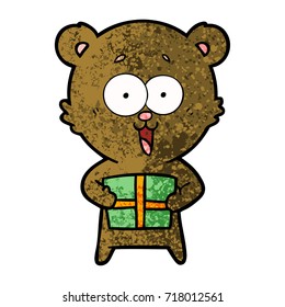 laughing teddy  bear with christmas present