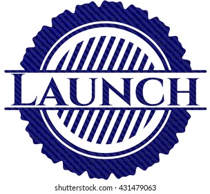 Launch badge with denim background