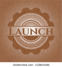 Launch badge with wood background
