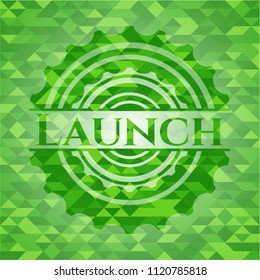 Launch realistic green emblem. Mosaic background