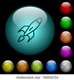 Launched rocket icons in color illuminated spherical glass buttons on black background. Can be used to black or dark templates