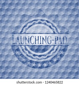 Launching-pad blue hexagon emblem.