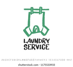 Laundry logo emblem and hand drawn typeface set isolated on white. Shirt hanging on a clothesline. Logo design elements. Lettering, sketch style.