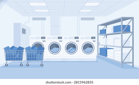 Laundry room interior featuring professional washers and wire baskets filled with blue linens near industrial storage shelving.