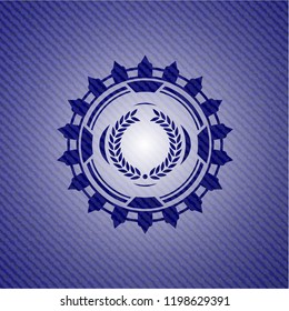 laurel wreath icon inside badge with denim texture
