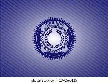 laurel wreath icon inside badge with denim texture