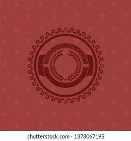 laurel wreath icon inside badge with red background