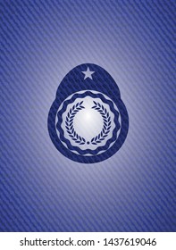 laurel wreath icon inside badge with denim texture