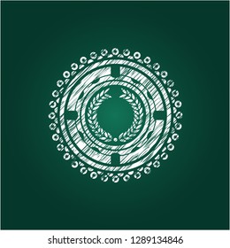 laurel wreath icon inside chalk emblem written on a blackboard