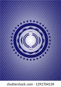 laurel wreath icon inside emblem with denim texture