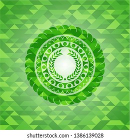 laurel wreath icon inside green emblem with triangle mosaic background