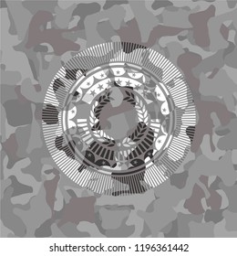 laurel wreath icon inside grey camouflage emblem