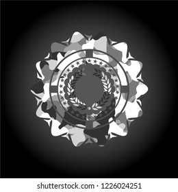 laurel wreath icon inside grey camo emblem