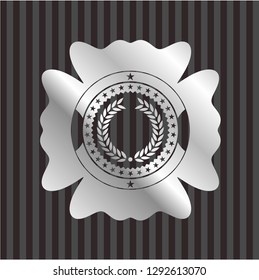 laurel wreath icon inside silver emblem or badge