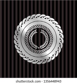 laurel wreath icon inside silver badge