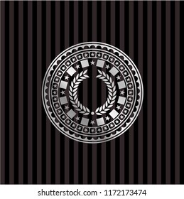 laurel wreath icon inside silvery badge