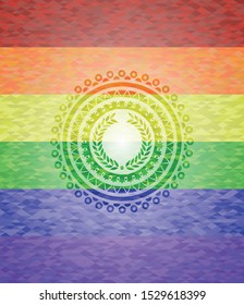laurel wreath icon on mosaic background with the colors of the LGBT flag