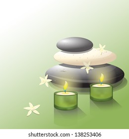 Lava rocks with two candles and vanilla flowers
