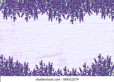 Lavender on a wooden floor. Floral background. Frame of violet flowers