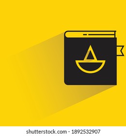 law book with shadow on yellow background vector