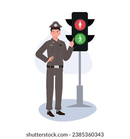 Law Enforcement concept. Thai Policeman at Traffic Signal is pointing the light