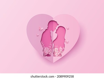 Layered paper cut art of lovers inside a heart shape with floral accents.