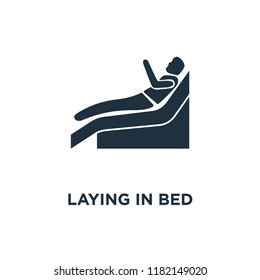 Laying In Bed icon. Black filled vector illustration. Laying In Bed symbol on white background. Can be used in web and mobile.