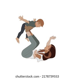 A laying mother throws the child up on her feet. Happy family and parenting concept image on a white background