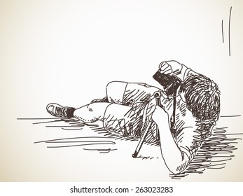 Laying photographer with photo camera, Hand drawn Vector illustration