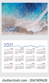 Layout of a pocket calendar with a grid for 2022. Sea background, waves and sea foam. English version of the grid. The week starts on Sunday