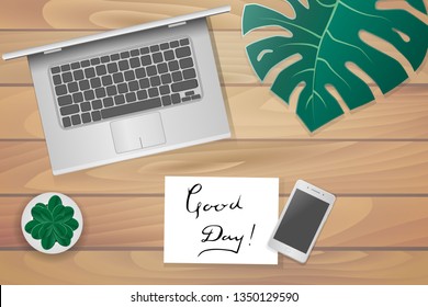 The layout in the style of flat lay: a laptop and items on the table