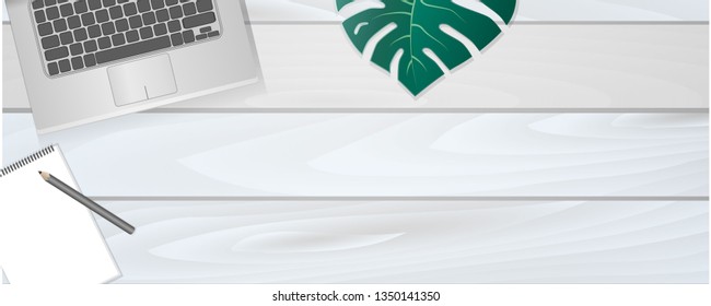 The layout in the style of flat lay: a laptop and items on the table, free space.