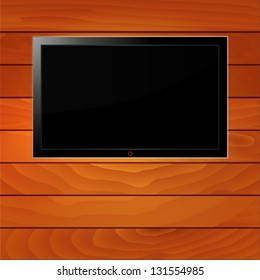 LCD TV on wood background