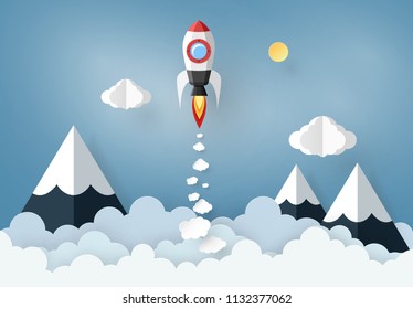 Leadership and Business concept with Origami made paper Rocket flying in the sky. paper art design and craft style. 